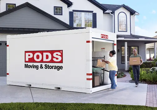 Couple moving into a PODS container